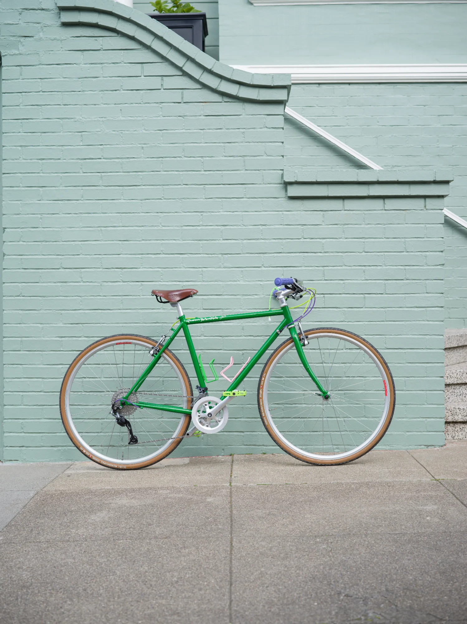 Green bike against green wall